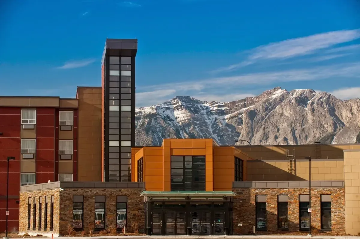 Mountain resort exterior against highland terrain